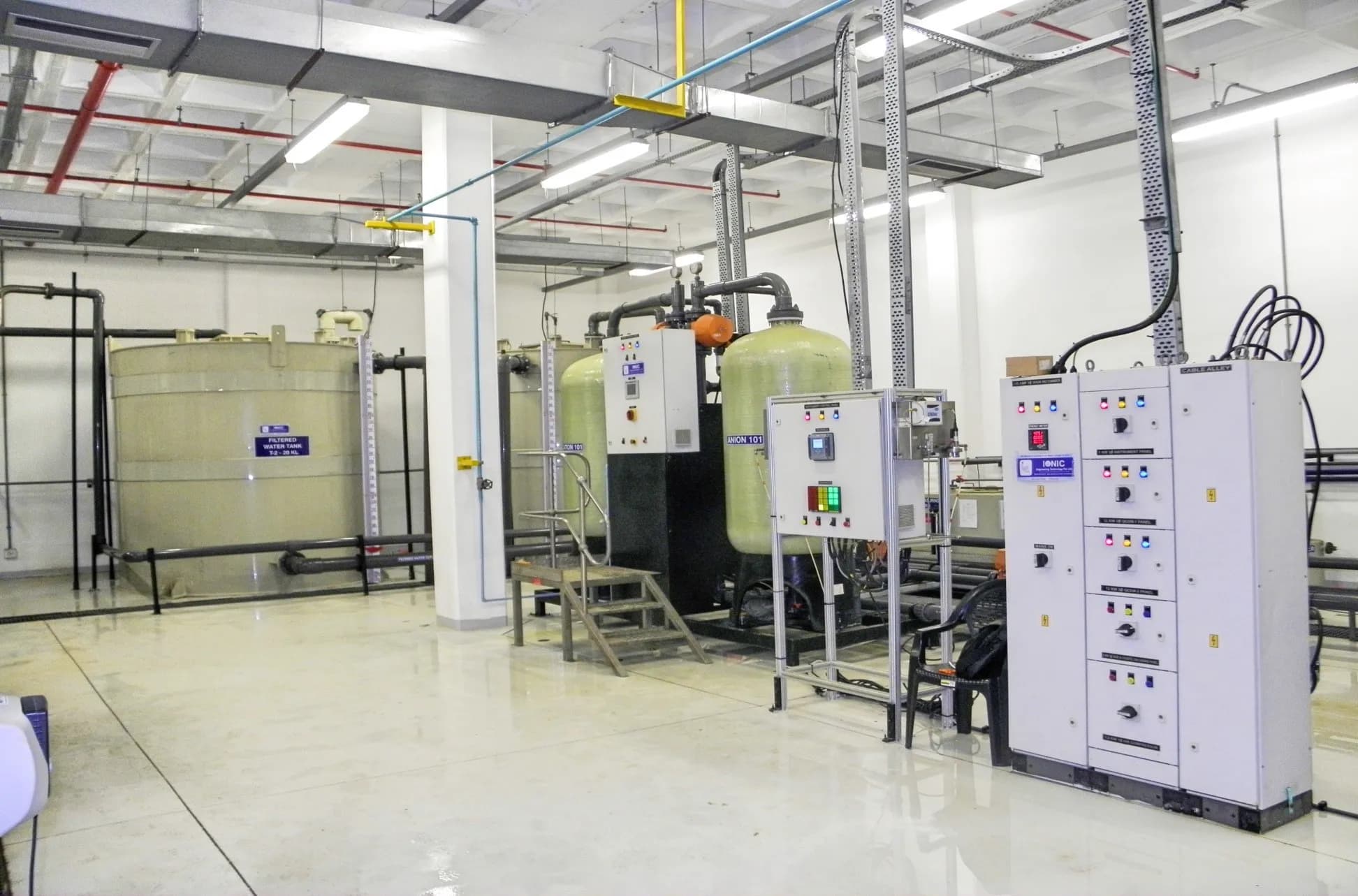Quick cycle automatic DM plant with pressure vessels, a storage tank and control panels